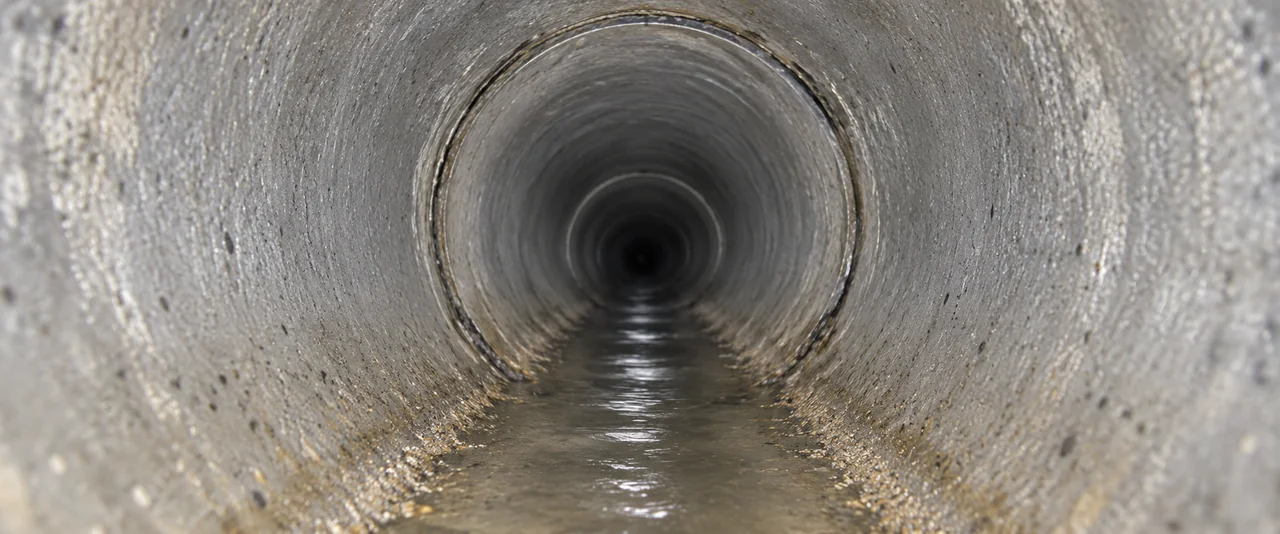 Illustrative camera inspection view looking inside a drainage pipe